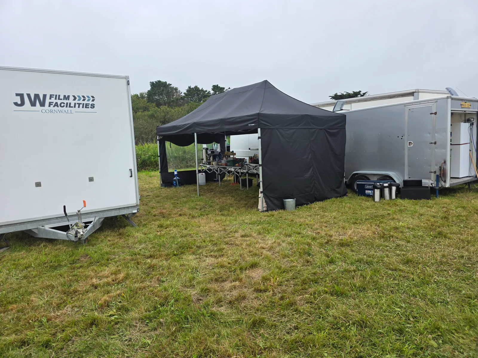 Salt Wind Catering gazebo pitched beside the unit trucks at a Cornwall film location