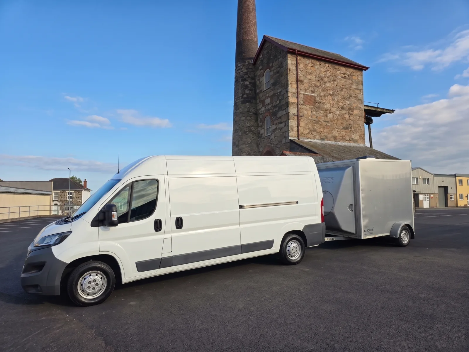 Salt Wind Catering's self-contained mobile kitchen for film and TV crews — van and trailer at a Cornish engine house near Redruth