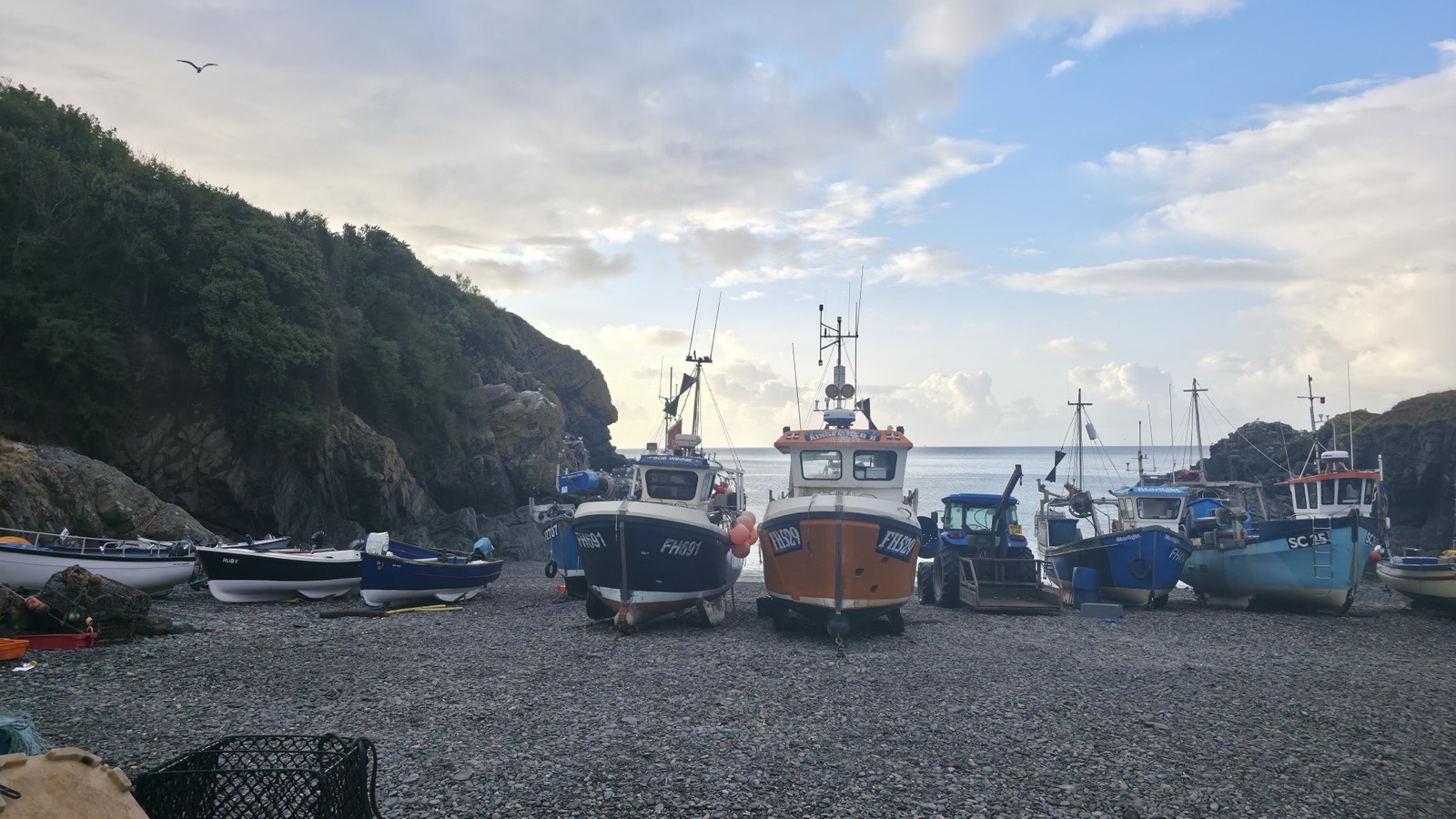Fishing boats hauled up on the shingle at Cadgwith Cove early on the morning of the shoot